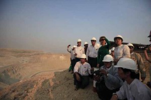 Aung San Suu Kyi watches a test explosion during a visit to the Letpadaung copper mine project in Sarlingyi Township on March 14, 2013. (Photo: Soe Zeya Tun / Reuters)