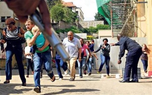 Nairobi westgate attacks Armed police officers provide cover for shoppers fleeing gunmen during the terrorist attack on the Westgate shopping mall in Nairobi, Kenya, in 2013 Credit: Reuters 