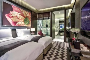 The bedroom of a suite at 137 Pillars Suites & Residences Bangkok