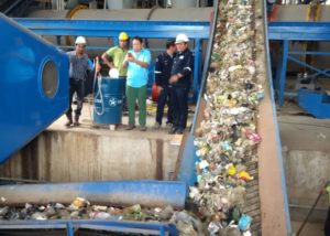 Staff working on Donasonic machinery at a plant in Thailand. 