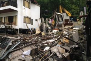 Rescuers work to clear debris from the collapsed building at Siam Beach Koh Chang in Trat. 