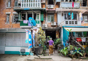 A resident walks into Yangon’s Min Ma Naing government housing project