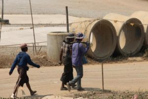 Workers walk to the Dawei development in Myanmar. New committees will be set up to move the multibillion-dollar megaproject forward.